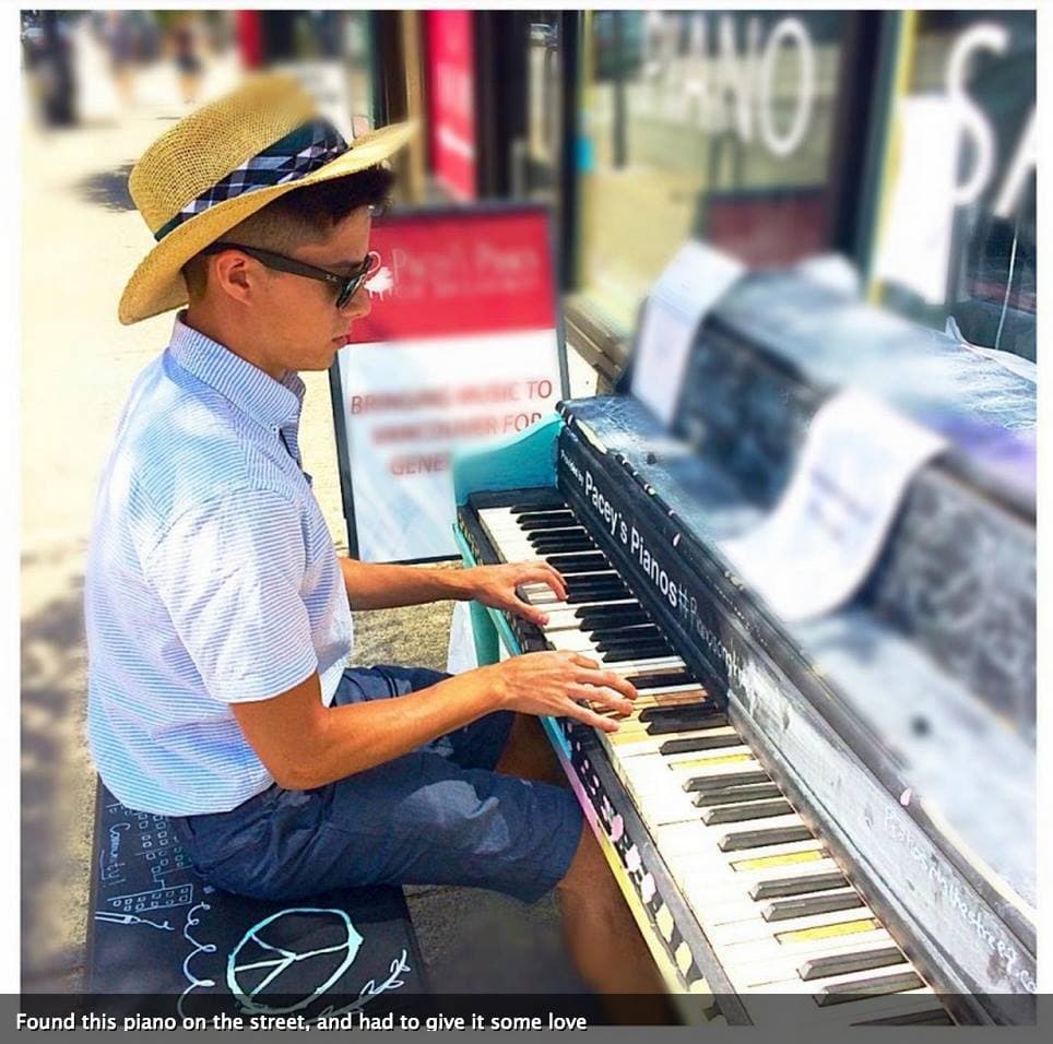 A young man in a straw boater leans into a weathered chalk-doodled piano: 'Found this piano on the street, and had to give it some love.'